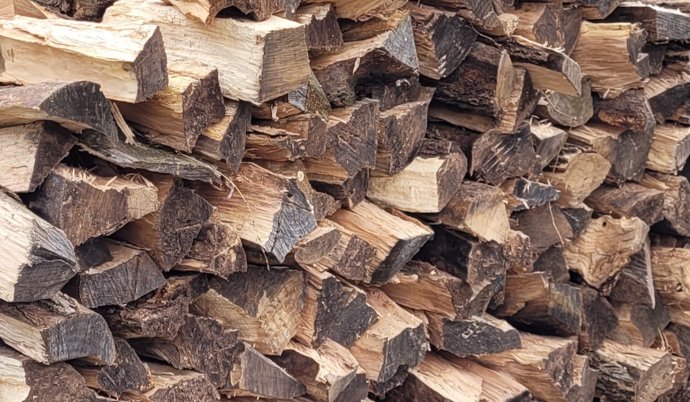 Split kiln dried firewood stacked